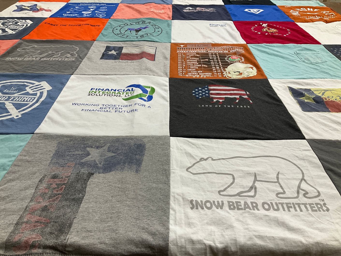 T-shirt quilt with outdoor activities, finance themes by Kristi from TX