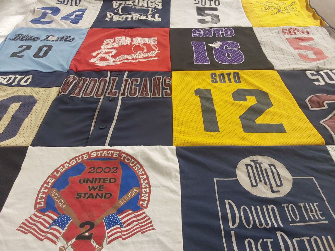 T-shirt quilt with sports, community themes by Dina from IL