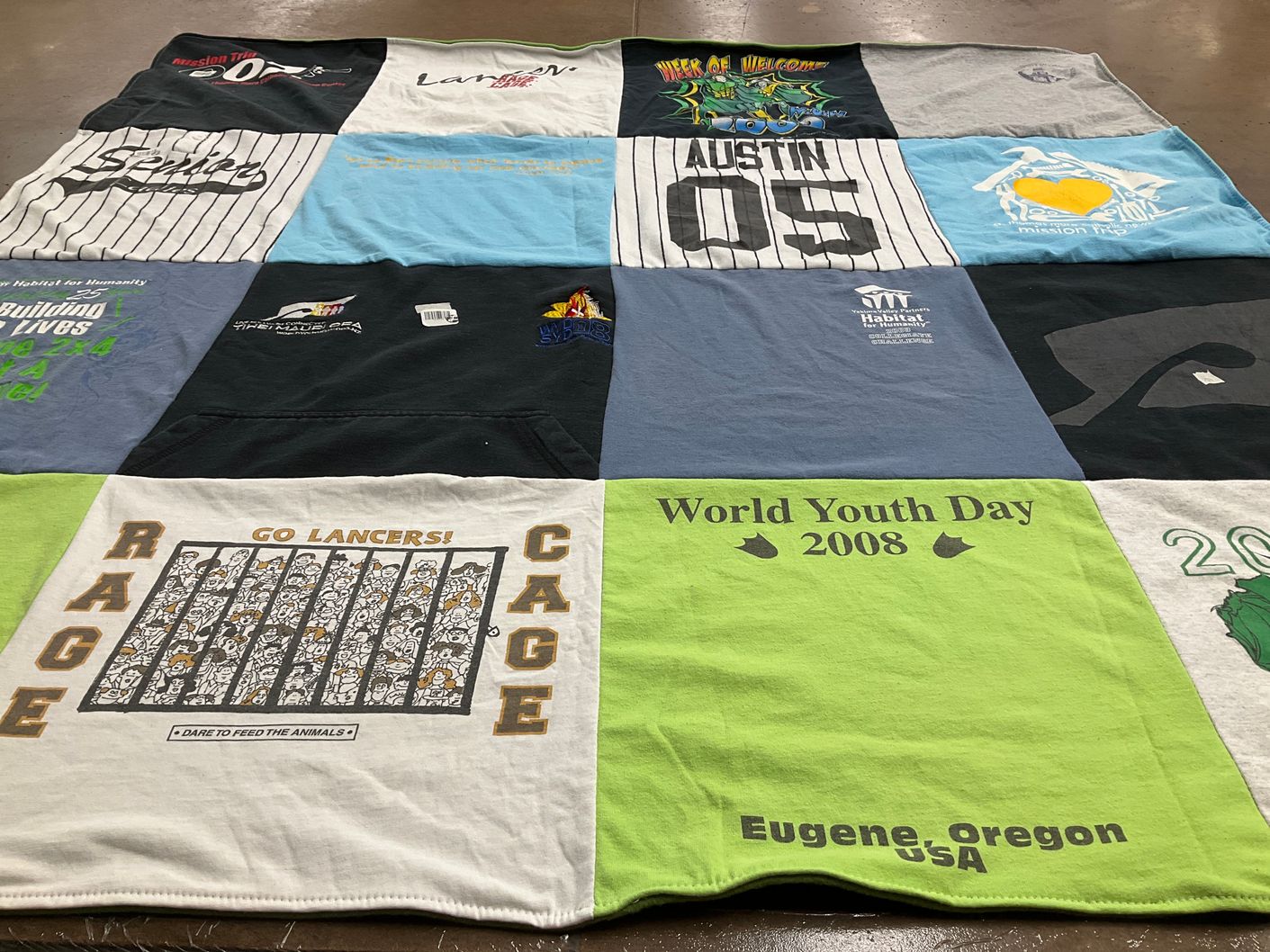T-shirt quilt with community service, youth activities themes by Leslie from CA