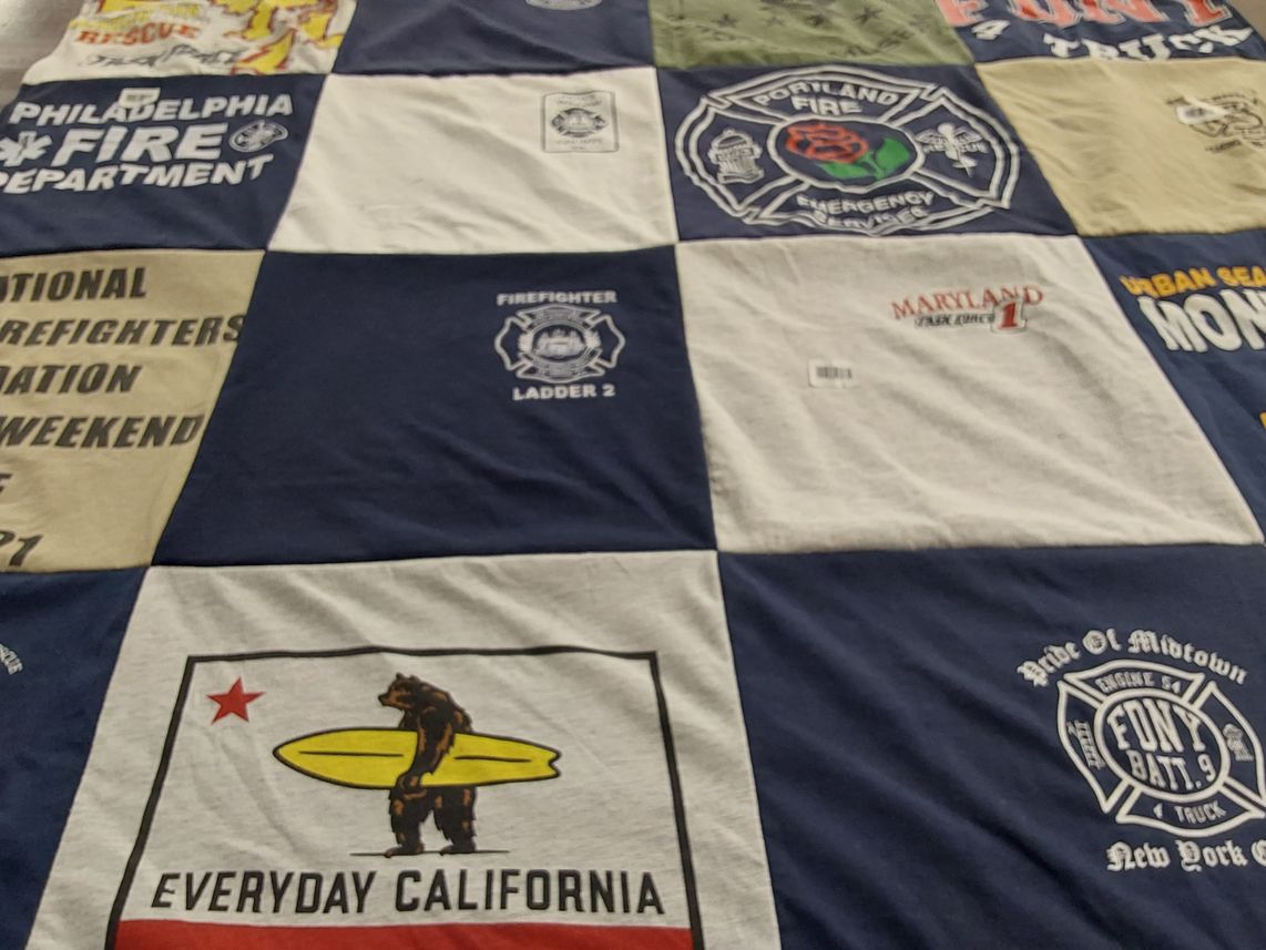 T-shirt quilt with firefighting, emergency services themes by Amy from MD