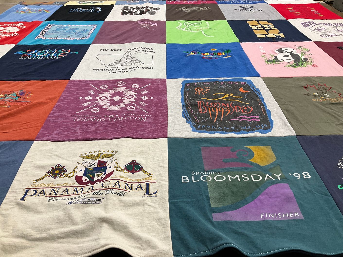 T-shirt quilt with travel, events themes by Carol from MT