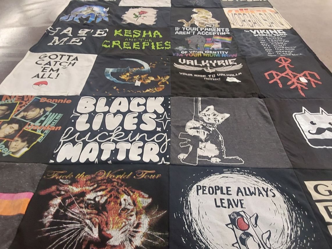 T-shirt quilt with music, social justice themes by jordan from MN