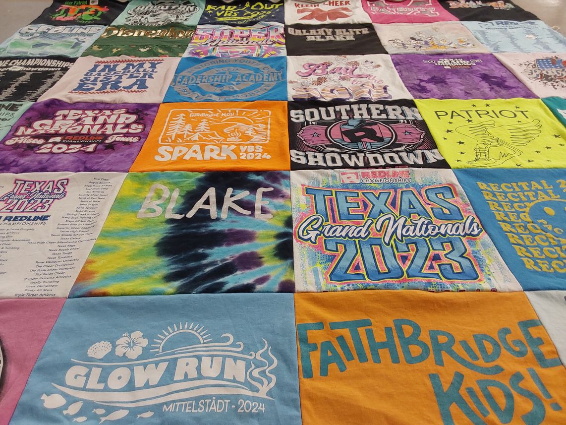 T-shirt quilt with cheerleading, youth programs themes by Susan from TX