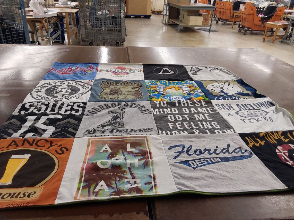 T-shirt quilt with travel, music themes by Brett from CA