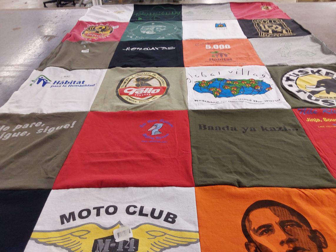 T-shirt quilt with community service, humanitarian themes by Vicki from IN