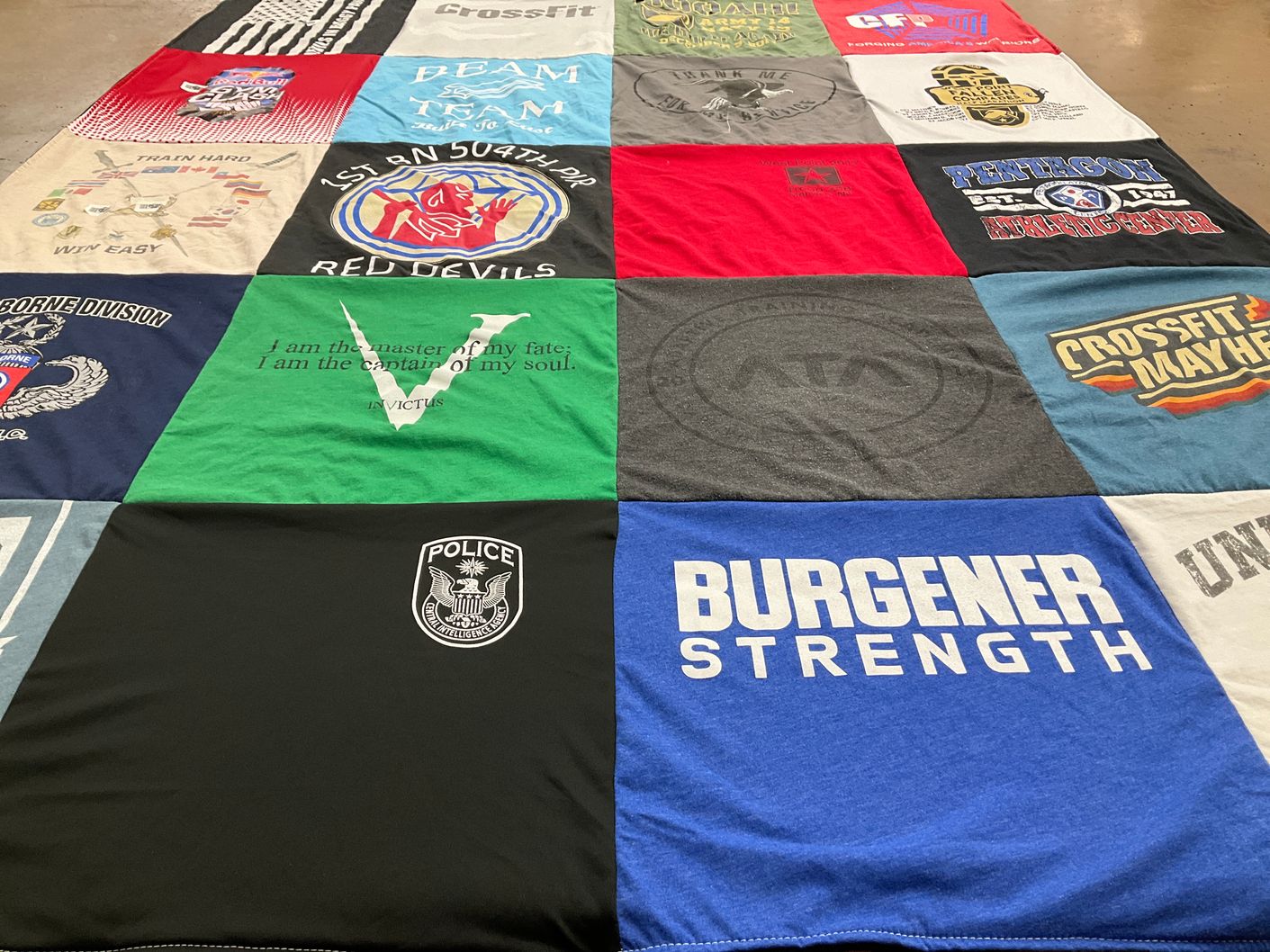 T-shirt quilt with fitness, strength training themes by Rachel from NJ