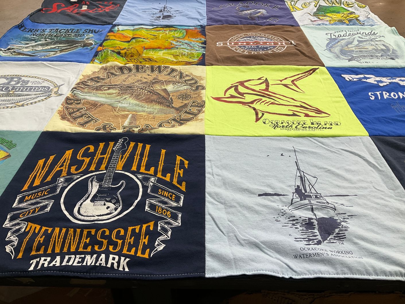 T-shirt quilt with fishing, music themes by Heather from PA