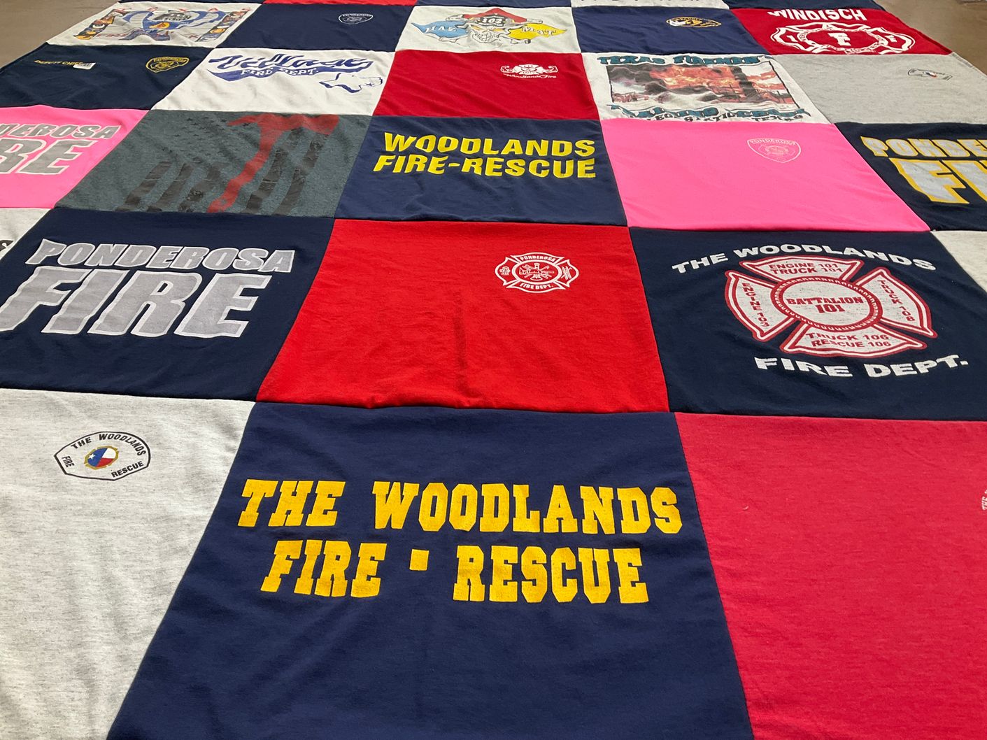 T-shirt quilt with firefighting, community service themes by Sharon from TX