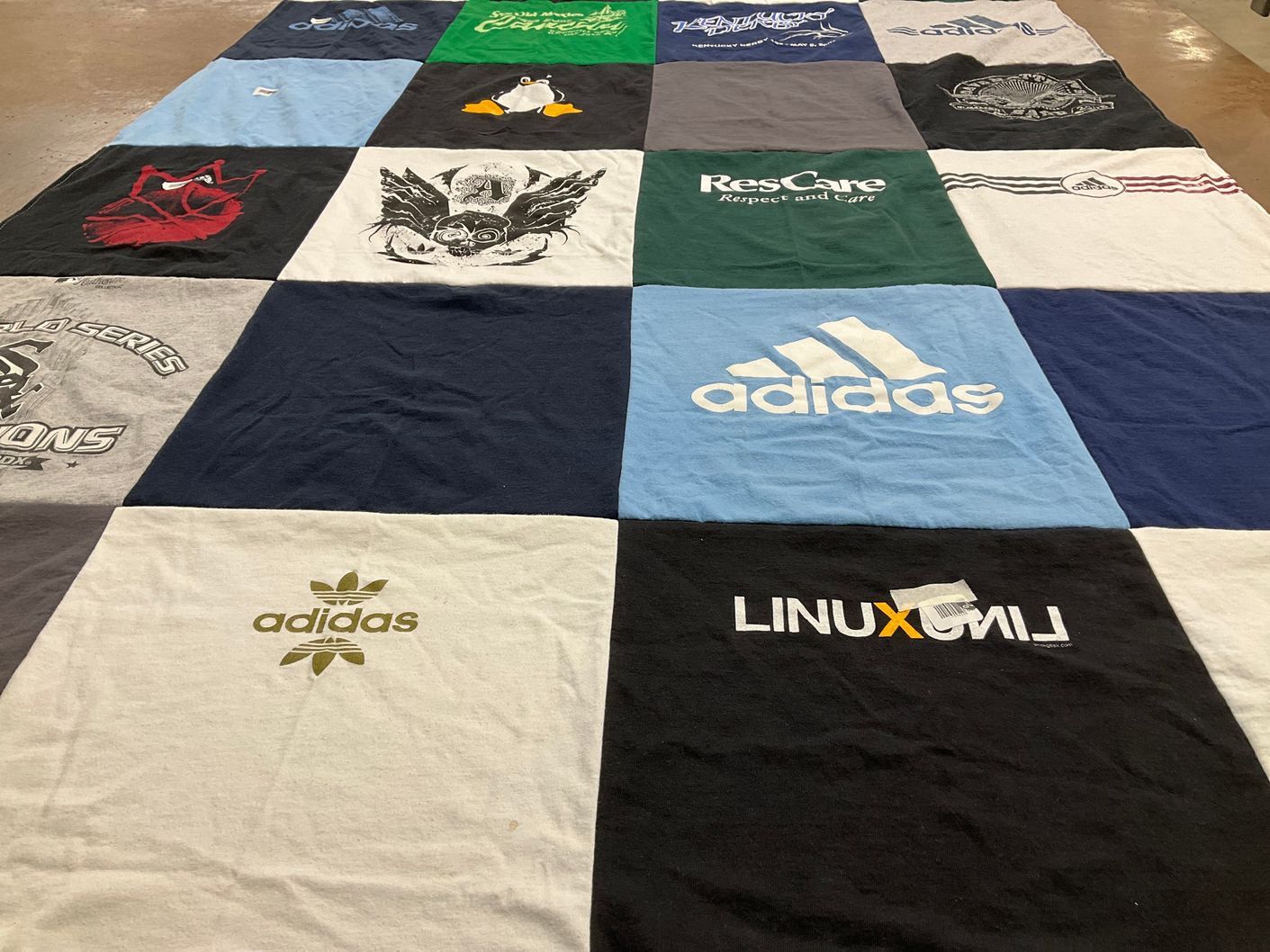 T-shirt quilt with sports, technology themes by Nancy from IN
