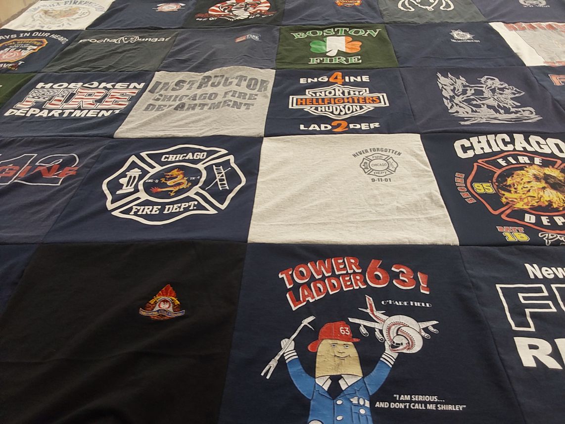 T-shirt quilt with firefighting, emergency services themes by Betty from IL