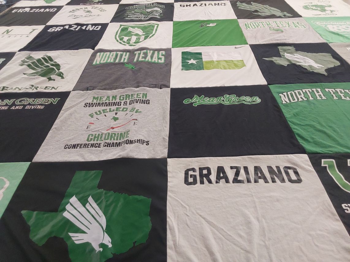 T-shirt quilt featuring mean green swimming and diving team, north texas mean green by Nicole from CO