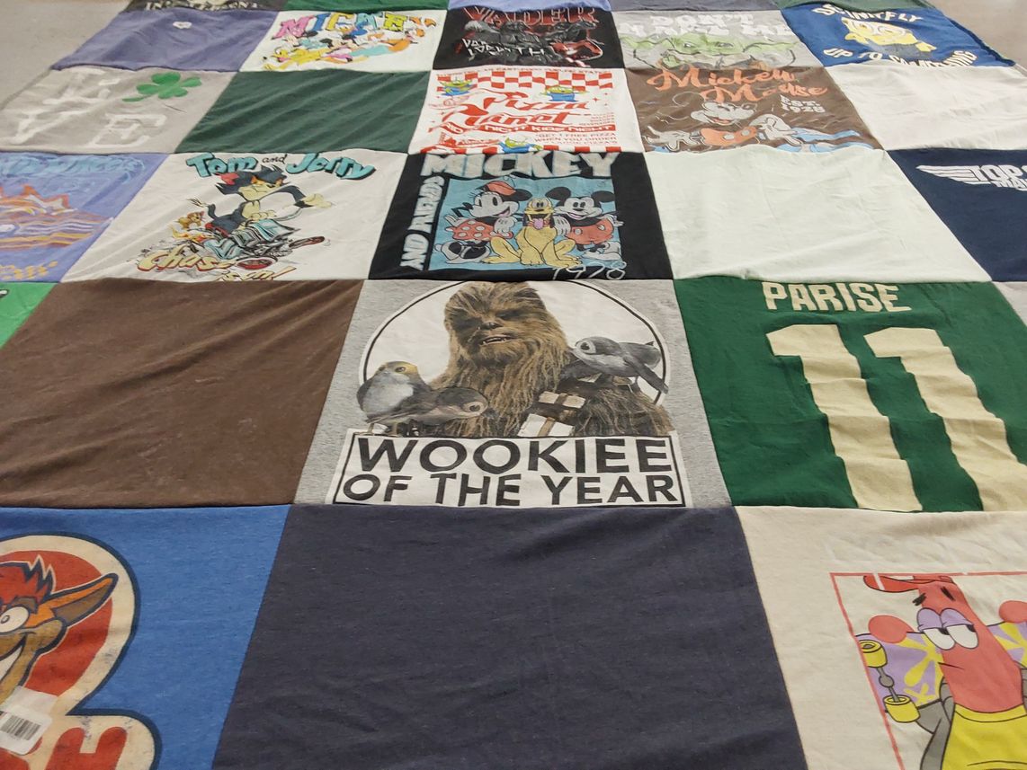 T-shirt quilt with cartoons, movies themes by Emily from MN