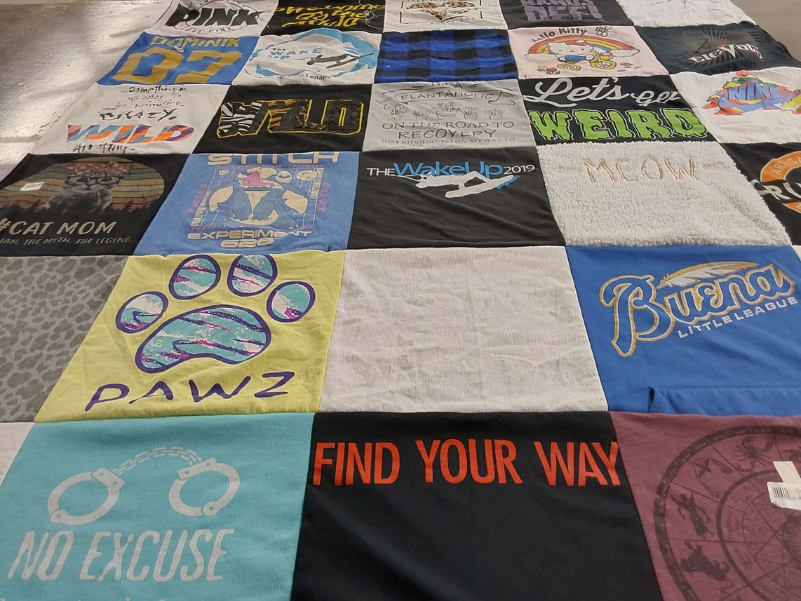 T-shirt quilt with cats, sports themes by Metta from AZ