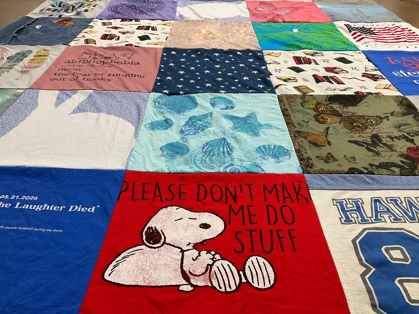 T-shirt quilt with reading, humor themes by Joyce from IL