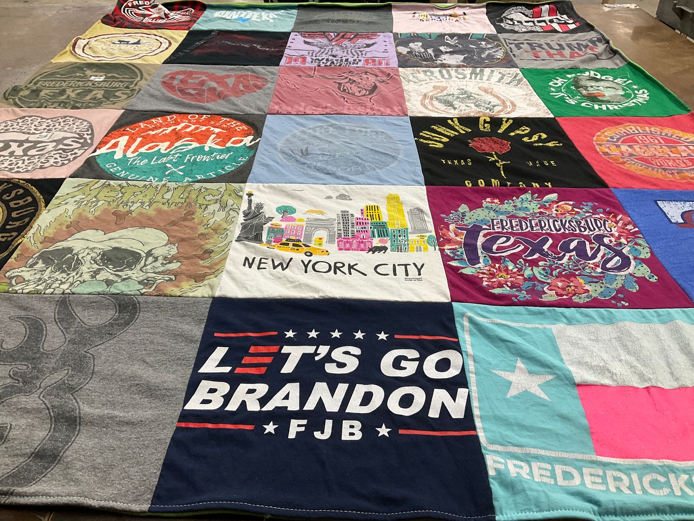 T-shirt quilt with travel, local culture themes by Kendra from TX