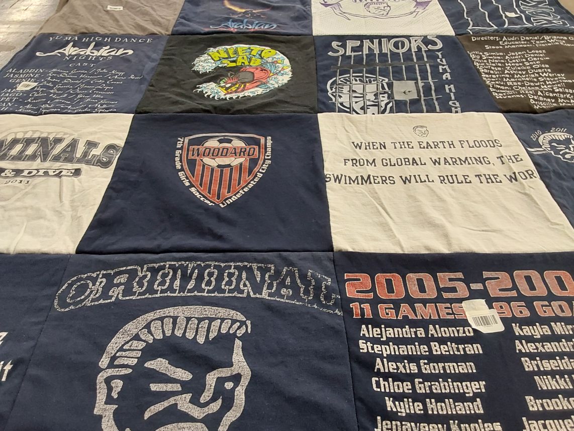 T-shirt quilt featuring understand city games by Alma from NC