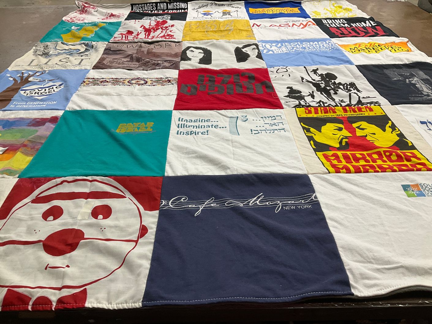 T-shirt quilt with art, social justice themes by Zehava from NJ