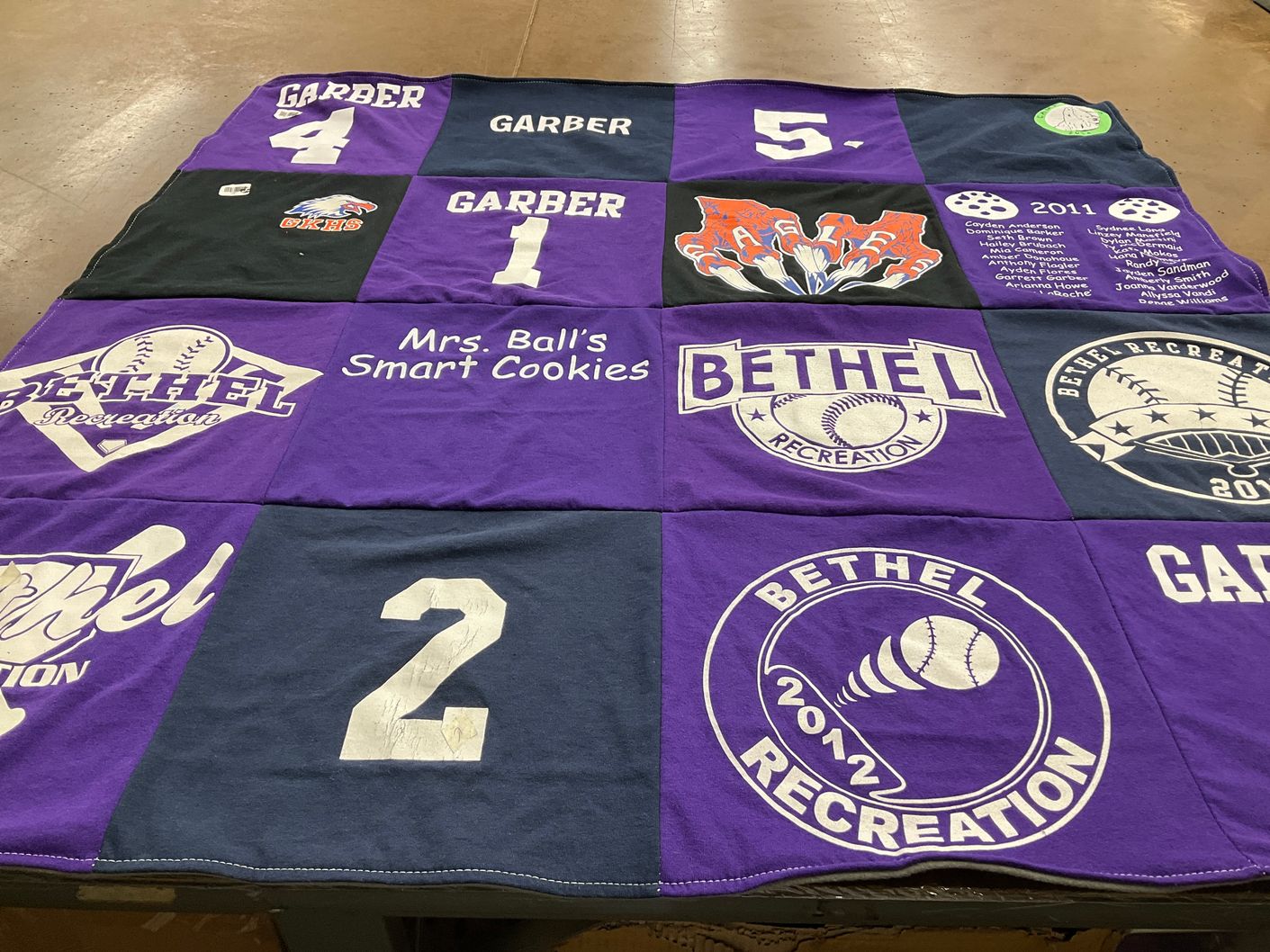 T-shirt quilt with softball, baking themes by Tricia from WA