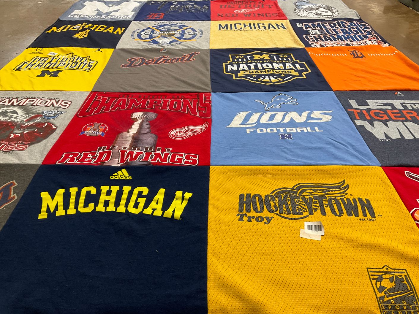 T-shirt quilt featuring detroit lions football, detroit red wings hockey by Carol from MI