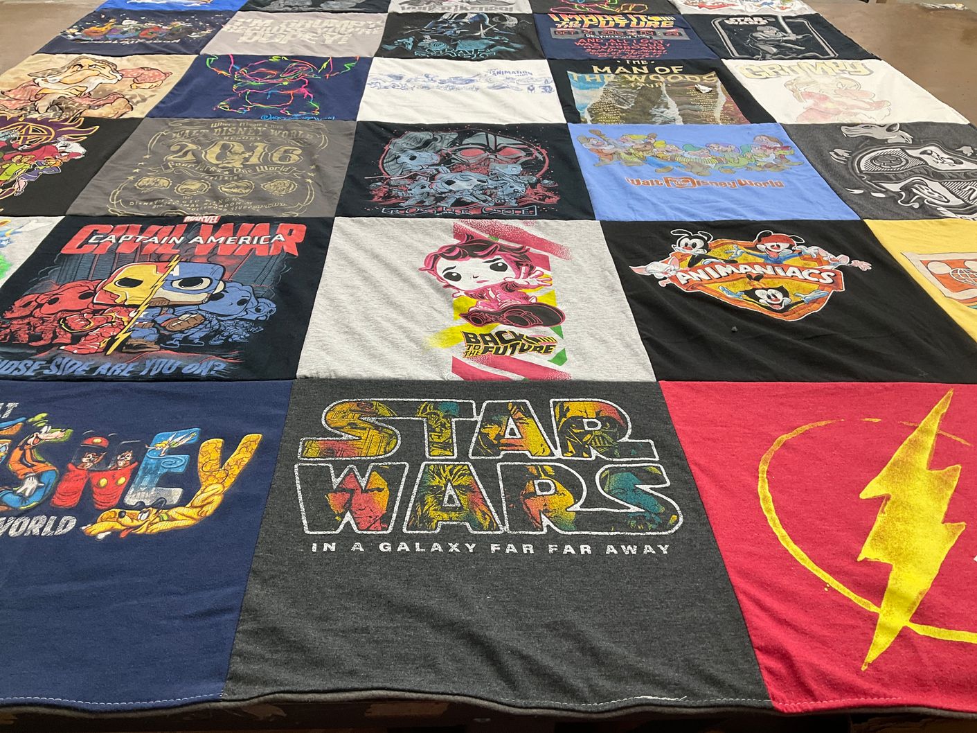 T-shirt quilt with movies, comics themes by Rochelle from MN