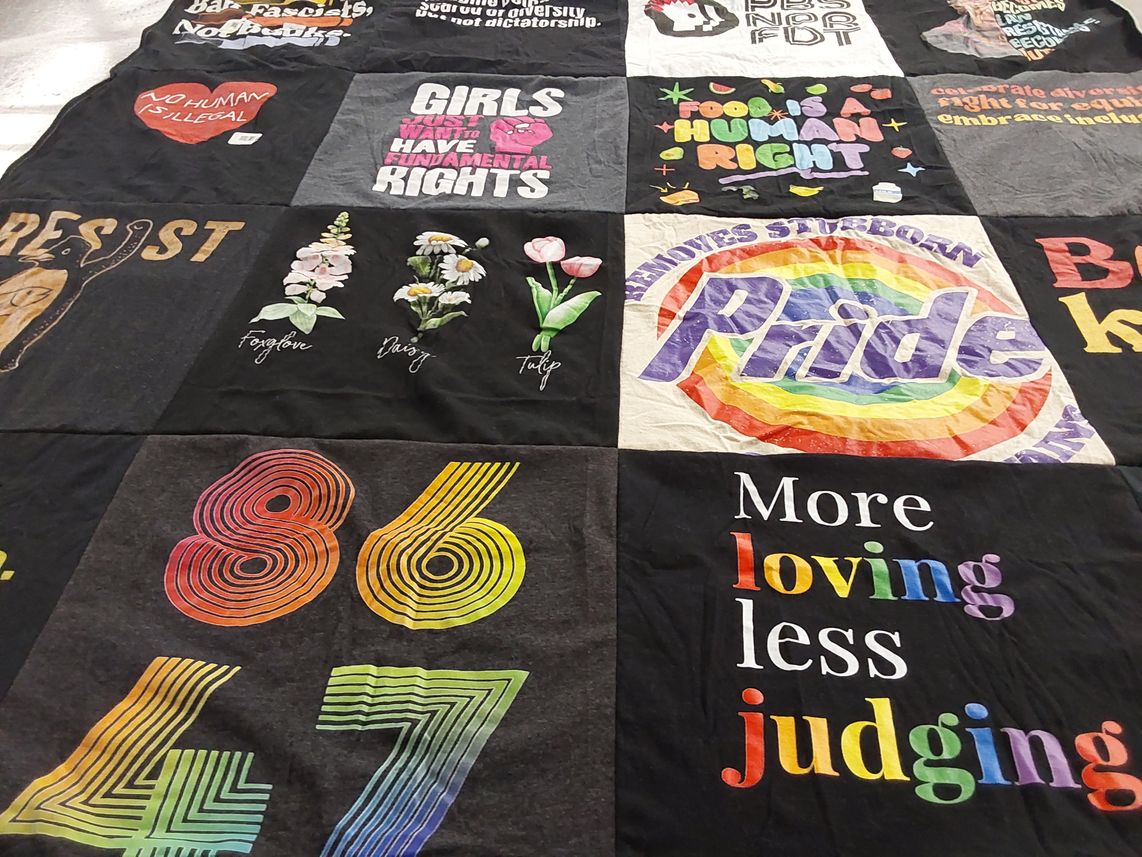 T-shirt quilt with social justice, lgbtq+ rights themes by Tamra from OR