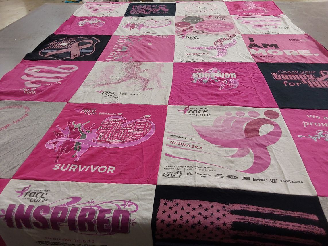 T-shirt quilt with breast cancer awareness, community support themes by Mitch from NE