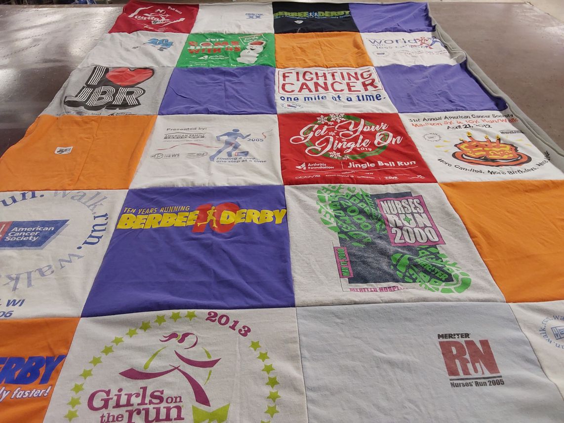 T-shirt quilt with running, charity themes by Heather from WI