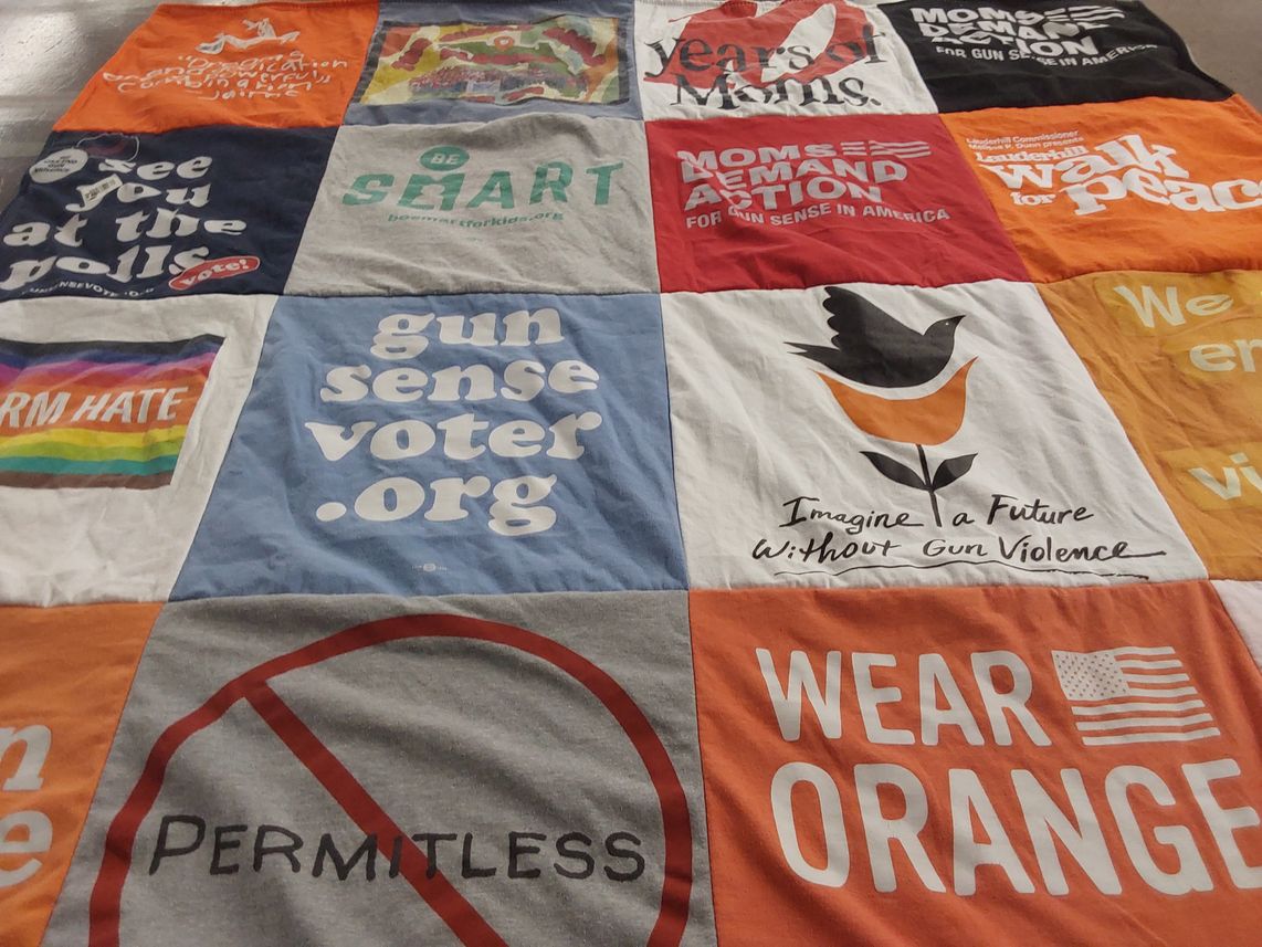 T-shirt quilt with gun control, community activism themes by Lucy from FL