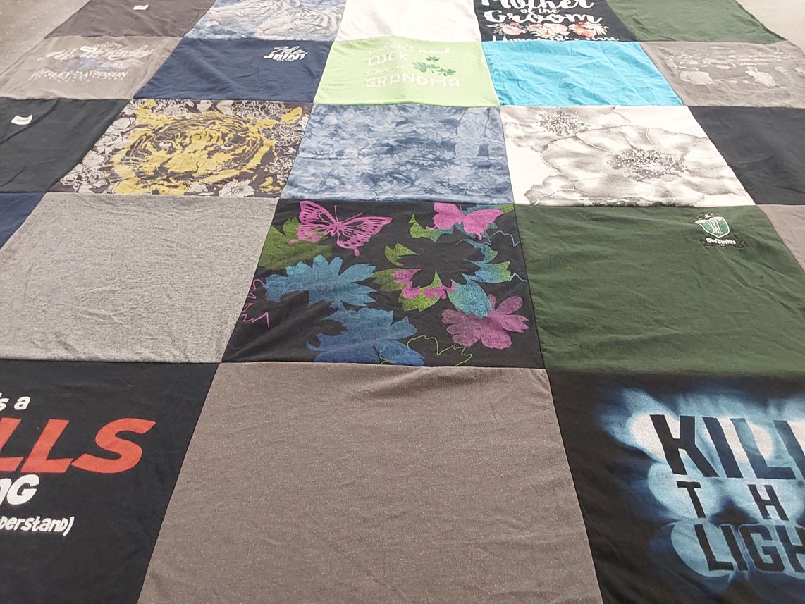 T-shirt quilt with quilting, textiles themes by Cheryle from NH