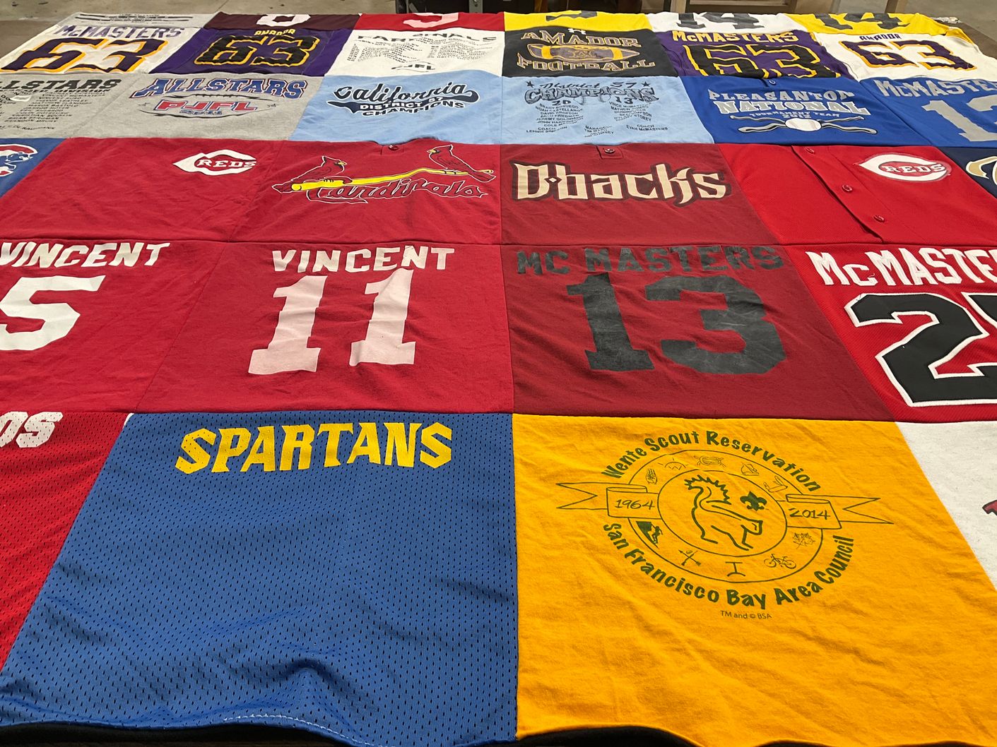 T-shirt quilt with sports, scouting themes by Lisa from CA