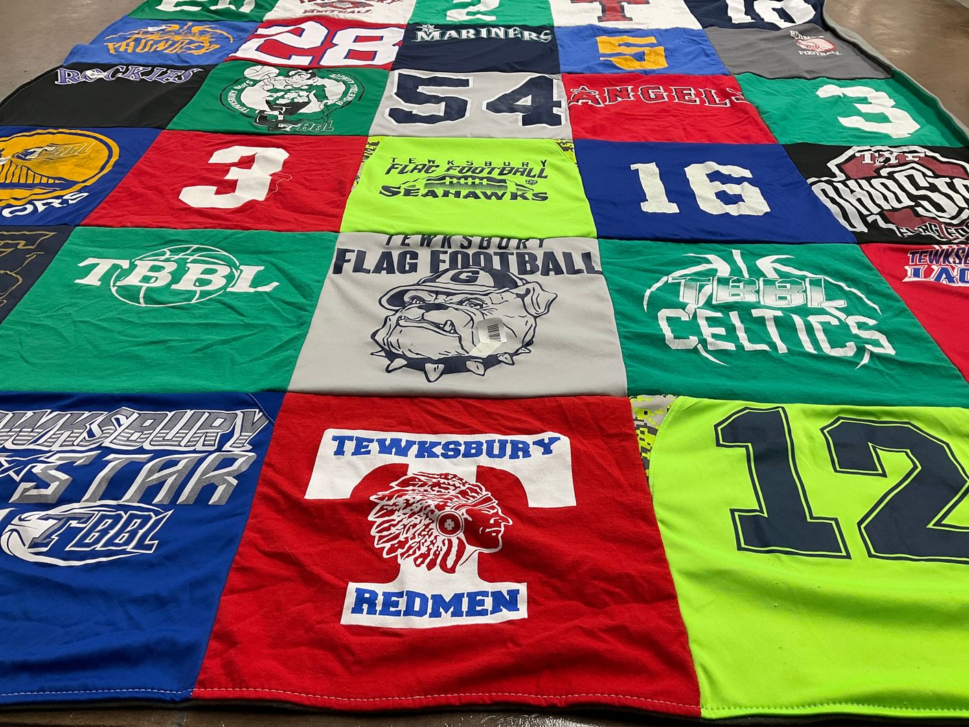 T-shirt quilt featuring tewksbury redmen, tbbw celtics by Loren from MA