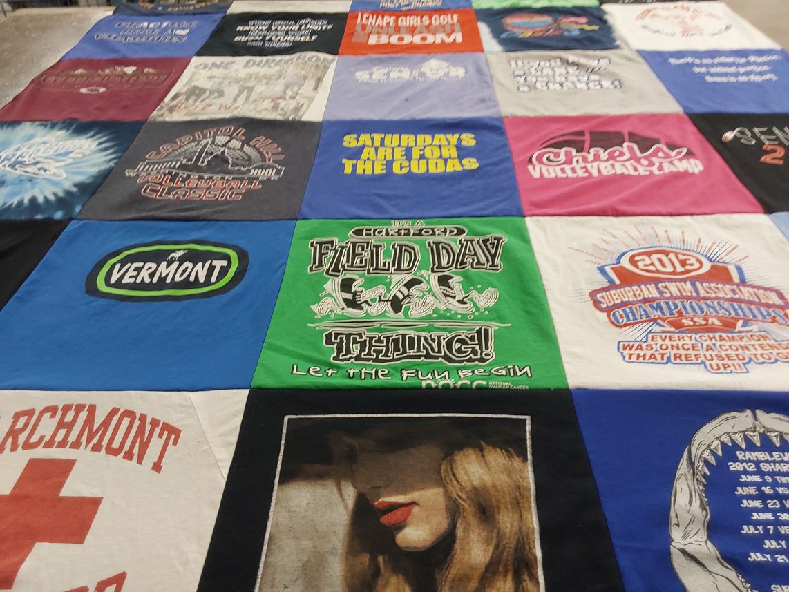 T-shirt quilt with swimming, volleyball themes by Laura from NJ