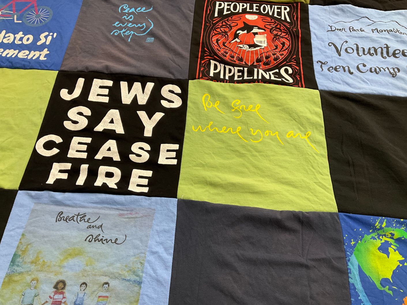 T-shirt quilt with activism, volunteering themes by Donald L from CA