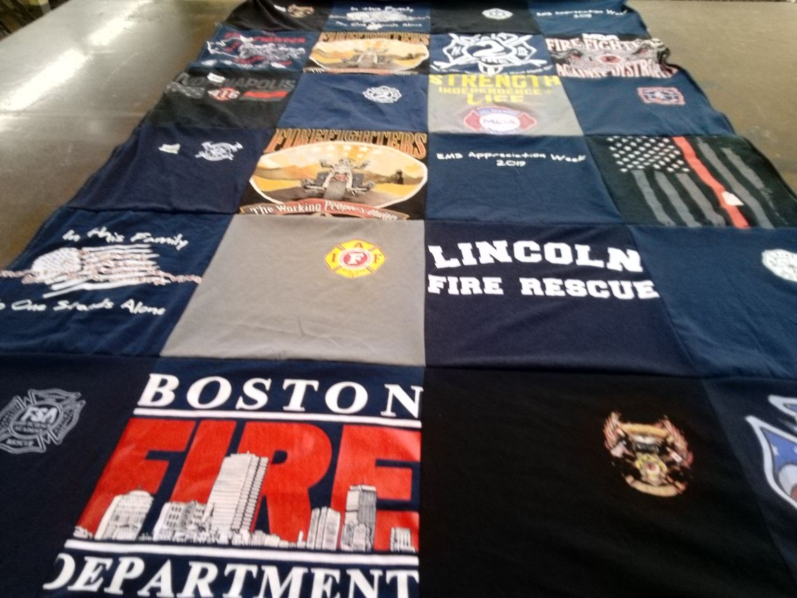 T-shirt quilt with firefighting, emergency services themes by Carrie from NV