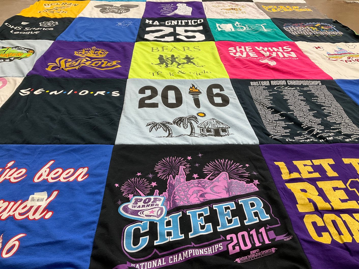 T-shirt quilt with cheerleading, graduation themes by Michelle from NJ