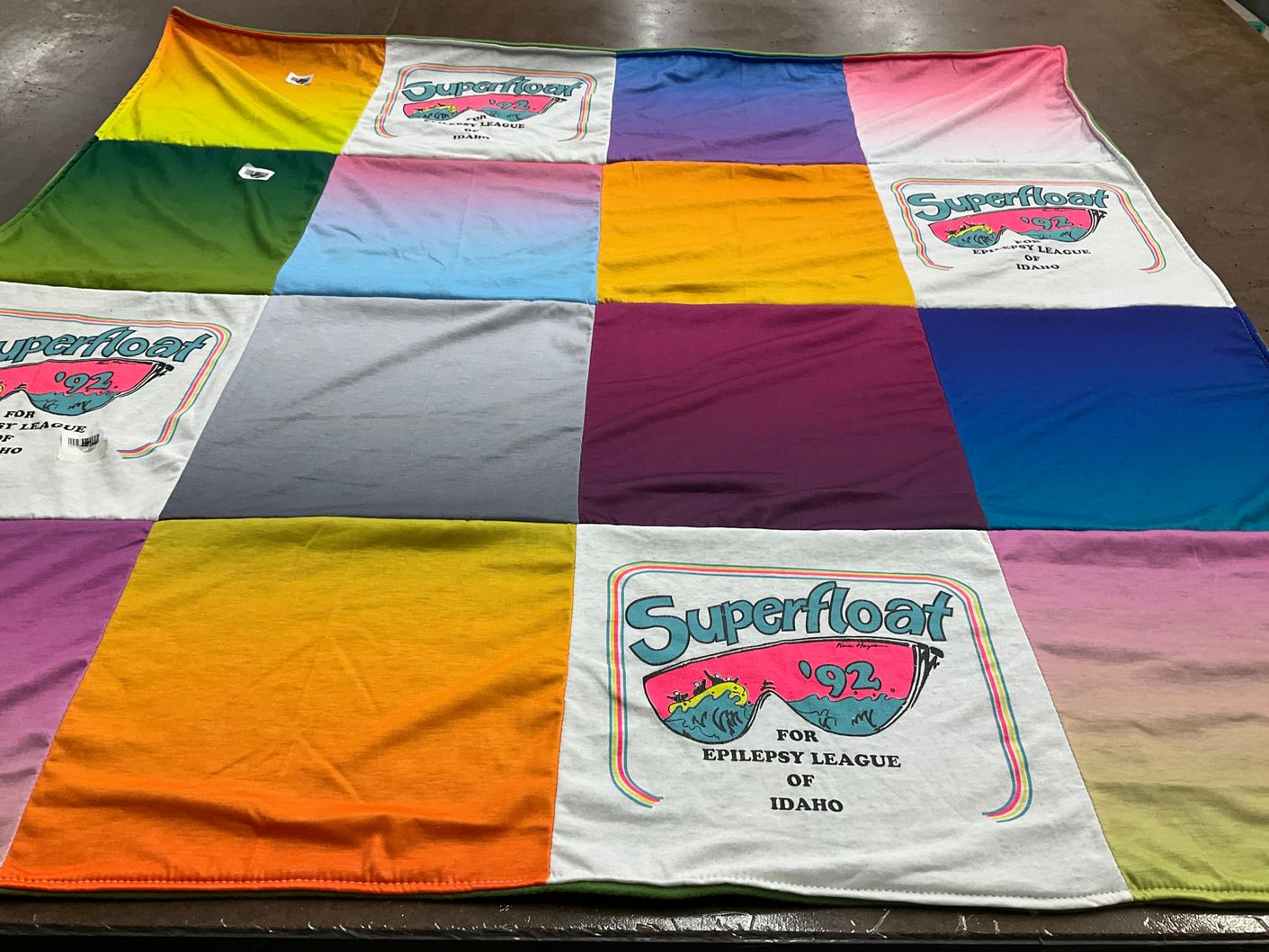 T-shirt quilt with community support, fundraising themes by Robyn from AZ