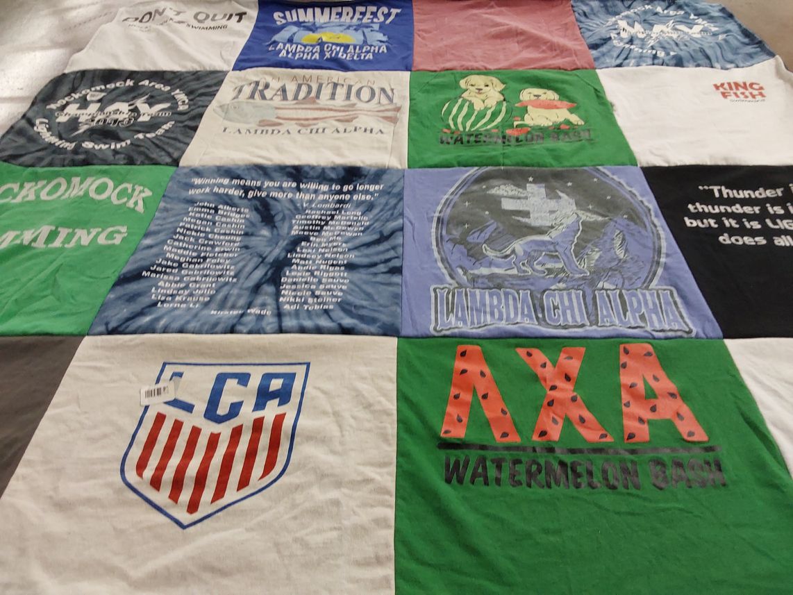 T-shirt quilt with swimming themes by Kathleen from MA