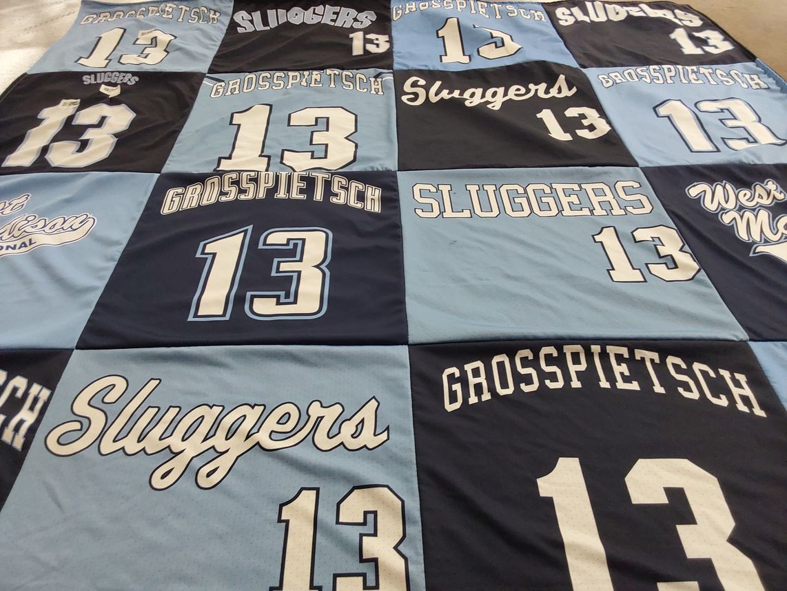 T-shirt quilt with sports themes by Elizabeth from WI