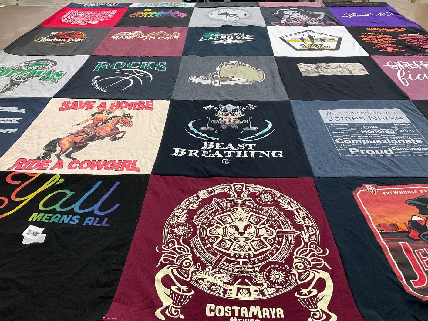 T-shirt quilt with cowboys, basketball themes by Emma from OH