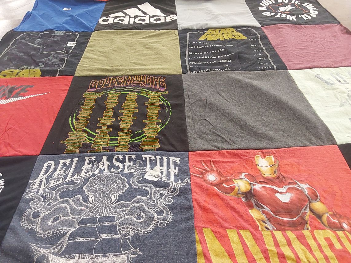 T-shirt quilt with music, movies themes by Melissa from KY