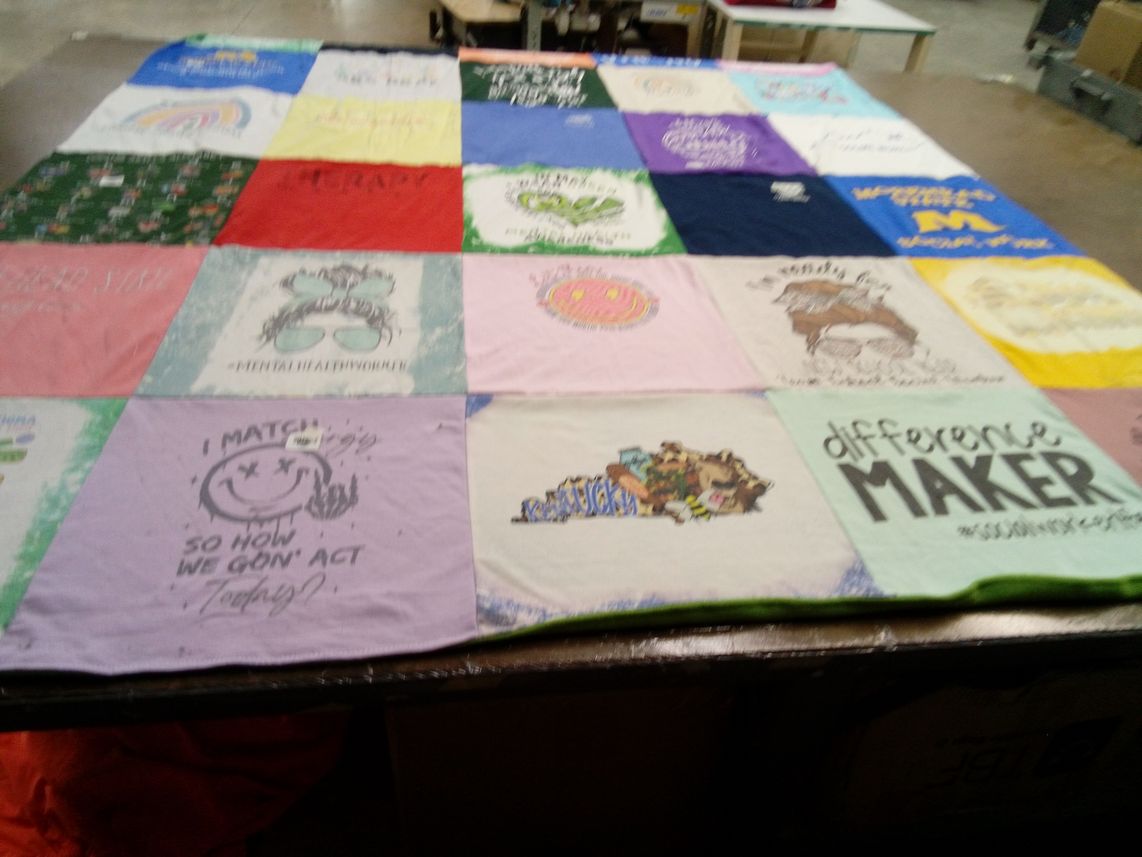 T-shirt quilt with mental health, community service themes by Phyllis from TX