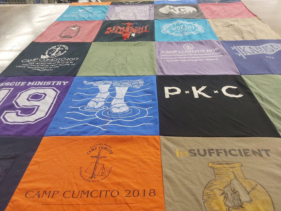 T-shirt quilt with youth camps, religious activities themes by Saundra from CO