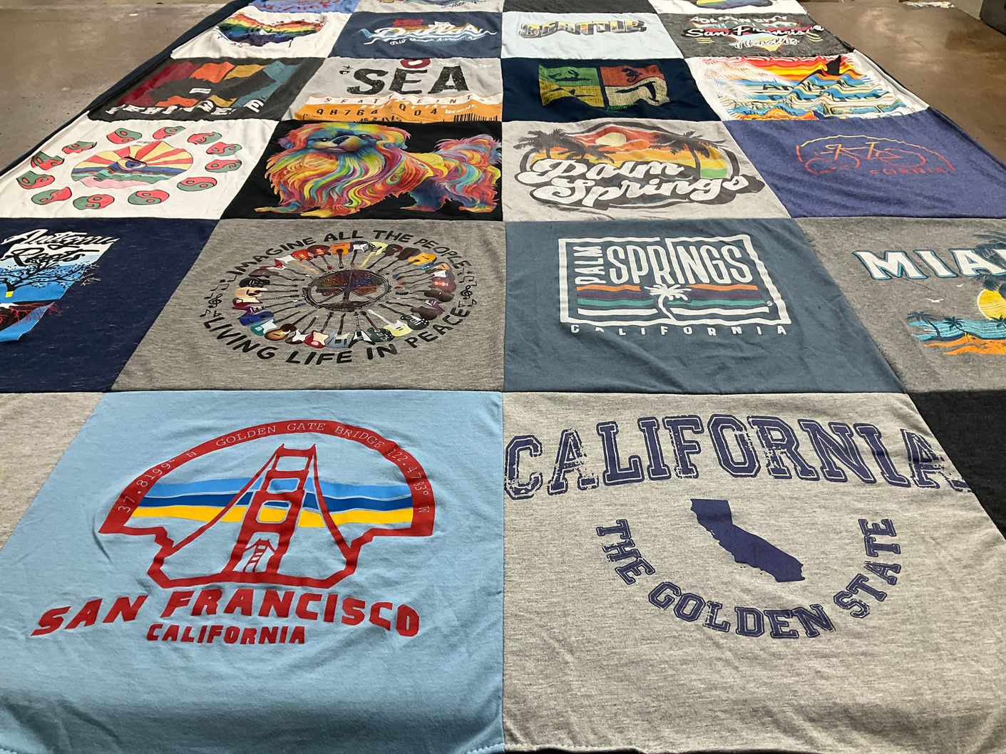 T-shirt quilt with travel, beaches themes by Rod from CA