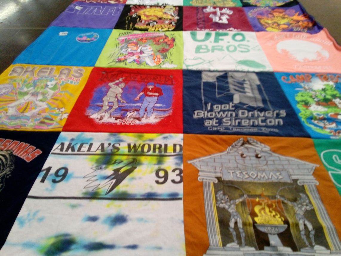 T-shirt quilt with camping, science fiction themes by Leah from WI