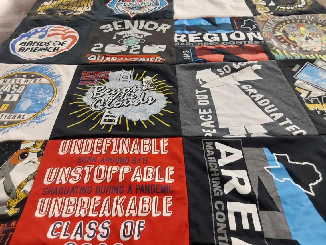 T-shirt quilt with marching, music themes by Adriana from TX