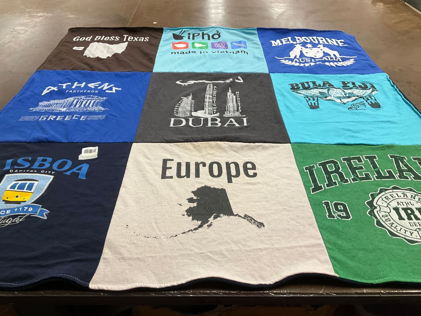 T-shirt quilt with travel, geography themes by Michelle from IL