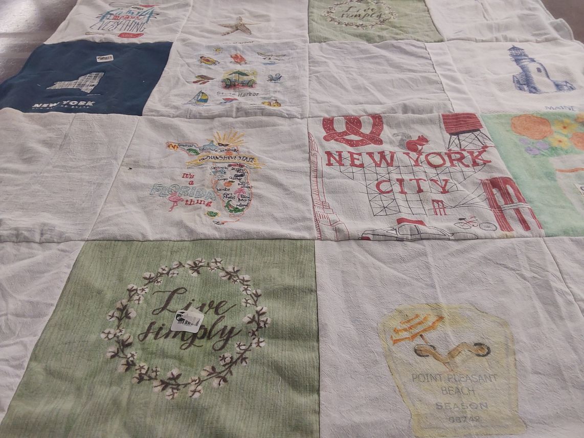 T-shirt quilt with travel, beach themes by Mary from NY