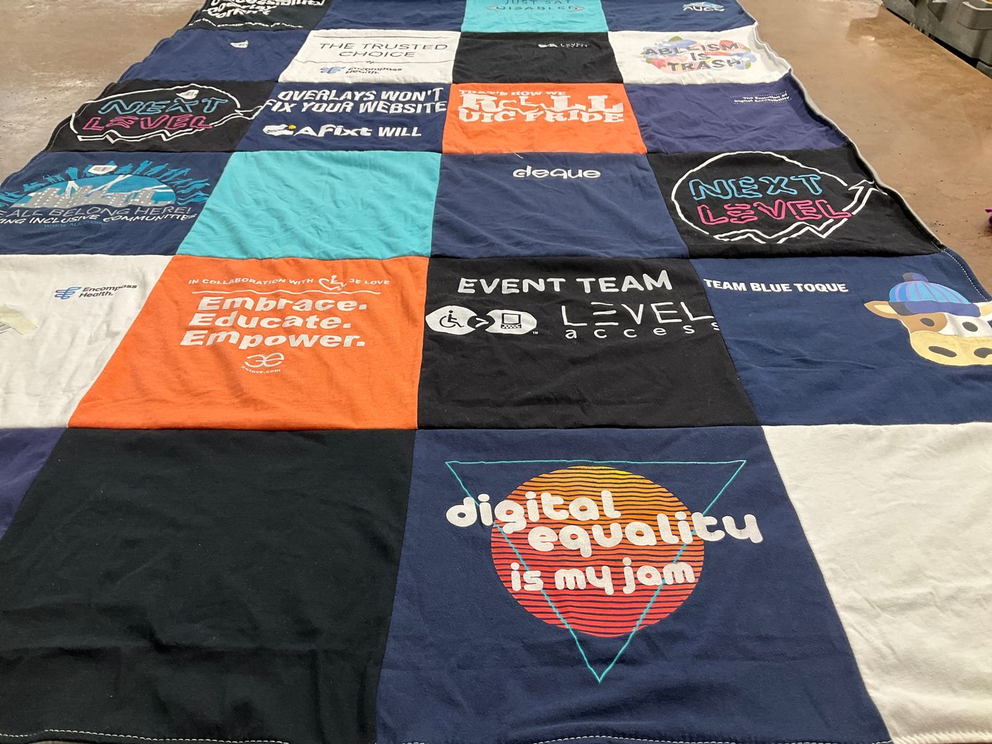T-shirt quilt with community, inclusivity themes by Nell from TN