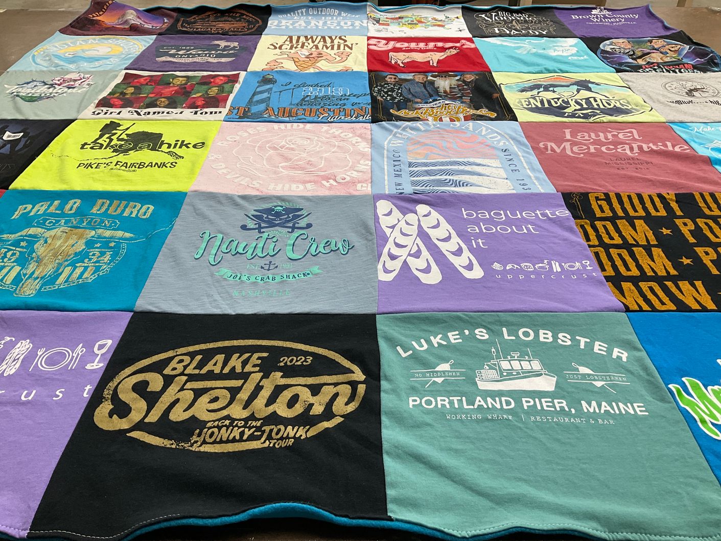 T-shirt quilt with food, music themes by Elaine from IN