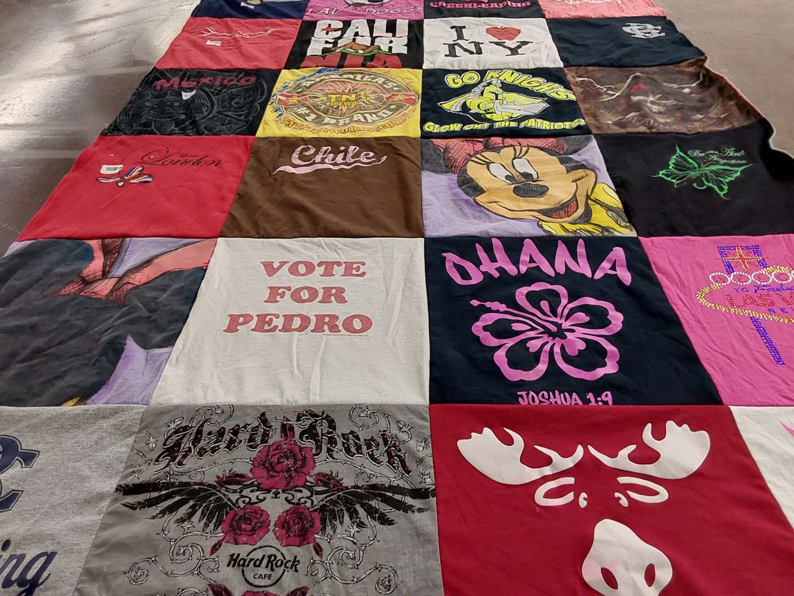 T-shirt quilt with travel, cafe themes by Travis from GA